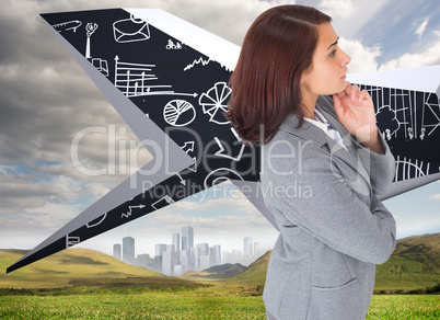 Composite image of focused businesswoman