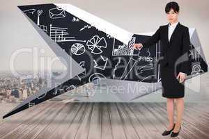 Composite image of focused businesswoman pointing