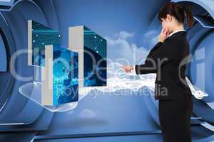 Composite image of businesswoman pointing