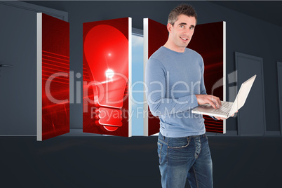 Composite image of man using a laptop
