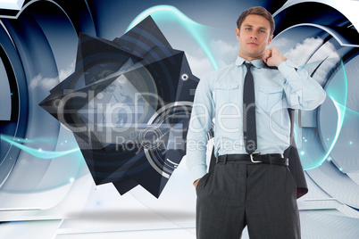 Composite image of serious businessman holding his jacket