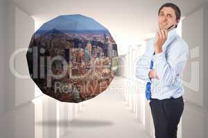 Composite image of thinking businessman holding pen