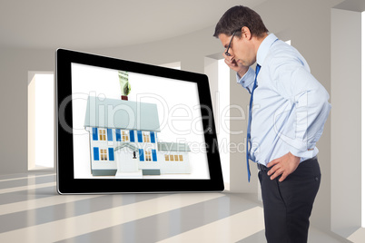 Composite image of thinking businessman tilting glasses