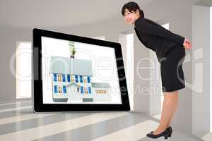 Composite image of smiling businesswoman bending