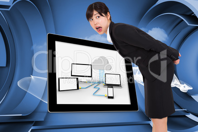 Composite image of surprised businesswoman bending