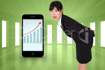 Composite image of surpised businesswoman bending