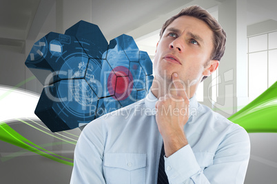 Composite image of thinking businessman with finger on chin