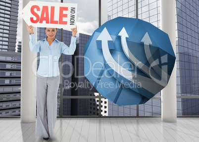 Composite image of businesswoman holding sign above her head