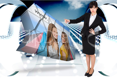 Composite image of focused businesswoman pointing