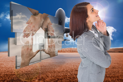 Composite image of smiling thoughtful businesswoman