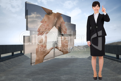 Composite image of smiling businesswoman pointing