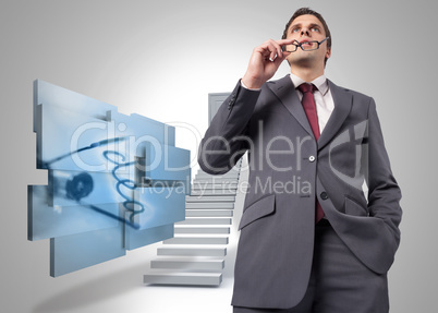 Composite image of thinking businessman holding his glasses