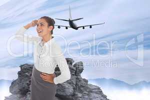 Composite image of smiling thoughtful businesswoman