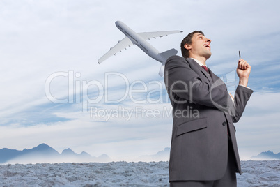 Composite image of thoughtful businessman holding pen