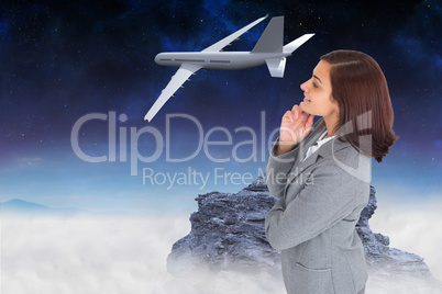 Composite image of smiling thoughtful businesswoman