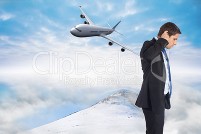 Composite image of thinking businessman scratching head