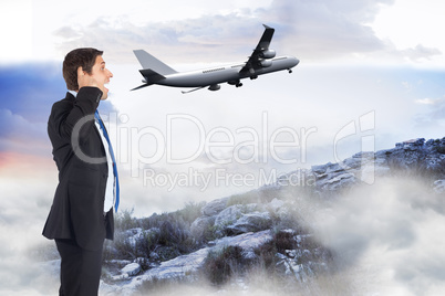 Composite image of thinking businessman scratching head