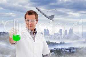 Composite image of young scientist working with a beaker