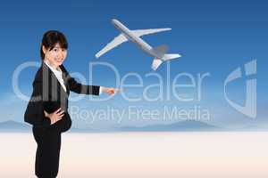 Composite image of smiling businesswoman pointing