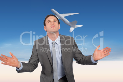 Composite image of businessman posing with hands out