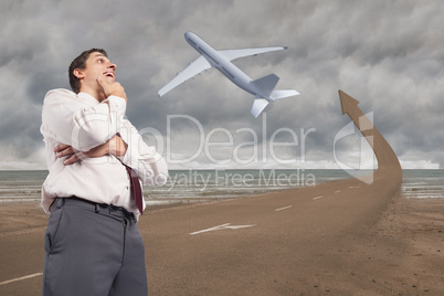 Composite image of thoughtful businessman with hand on chin