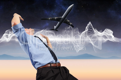 Composite image of businessman posing with arms raised