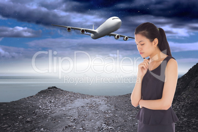 Composite image of thinking businesswoman