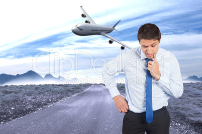 Composite image of thinking businessman touching his chin