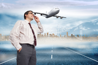 Composite image of thinking businessman touching his glasses