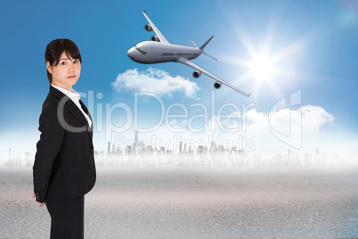 Composite image of serious businesswoman