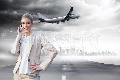 Composite image of cheerful elegant businesswoman on the phone