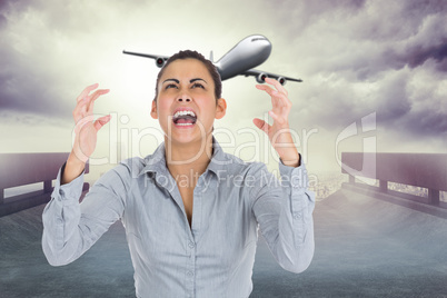 Composite image of furious businesswoman gesturing