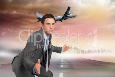 Composite image of businessman posing with hands out