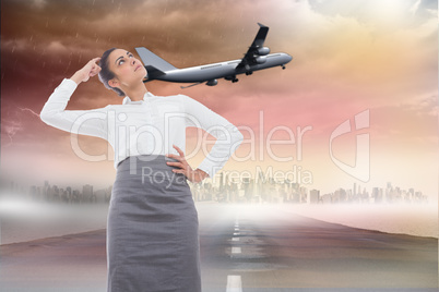 Composite image of focused businesswoman