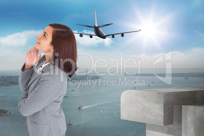 Composite image of smiling thoughtful businesswoman