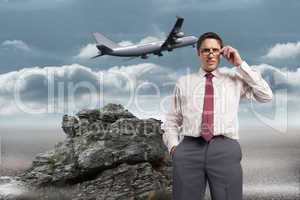 Composite image of thinking businessman touching his glasses