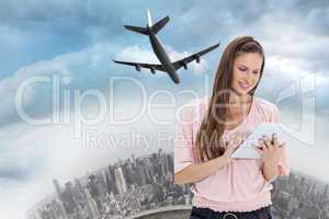 Composite image of close up of a girl using a touchpad