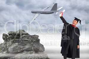 Composite image of delighted boy celebrating his graduation