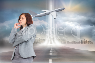 Composite image of worried businesswoman