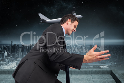 Composite image of businessman posing with arms out