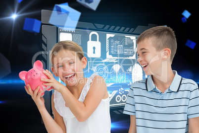 Composite image of smiling young girl holding piggy bank