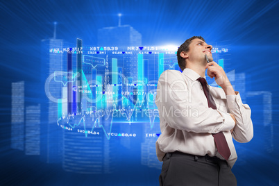 Composite image of thoughtful businessman holding pen to chin