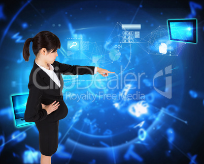 Composite image of focused businesswoman pointing