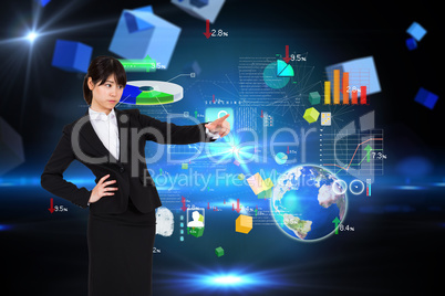 Composite image of focused businesswoman pointing