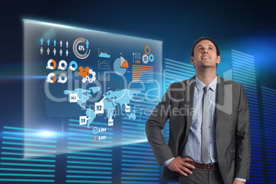 Composite image of smiling businessman with hand on hip