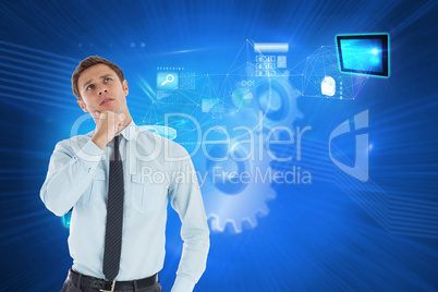 Composite image of thoughtful businessman with hand on chin