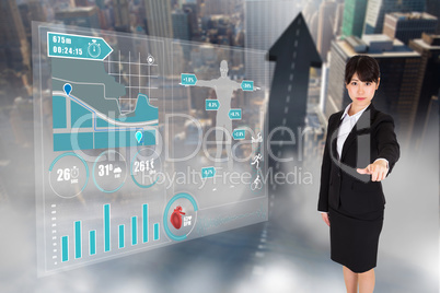 Composite image of focused businesswoman pointing