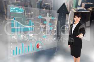 Composite image of focused businesswoman pointing