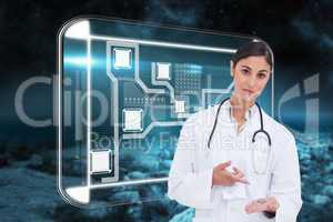 Composite image of female doctor pointing at pill in her hand