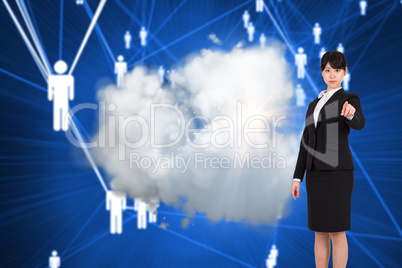 Composite image of focused businesswoman pointing